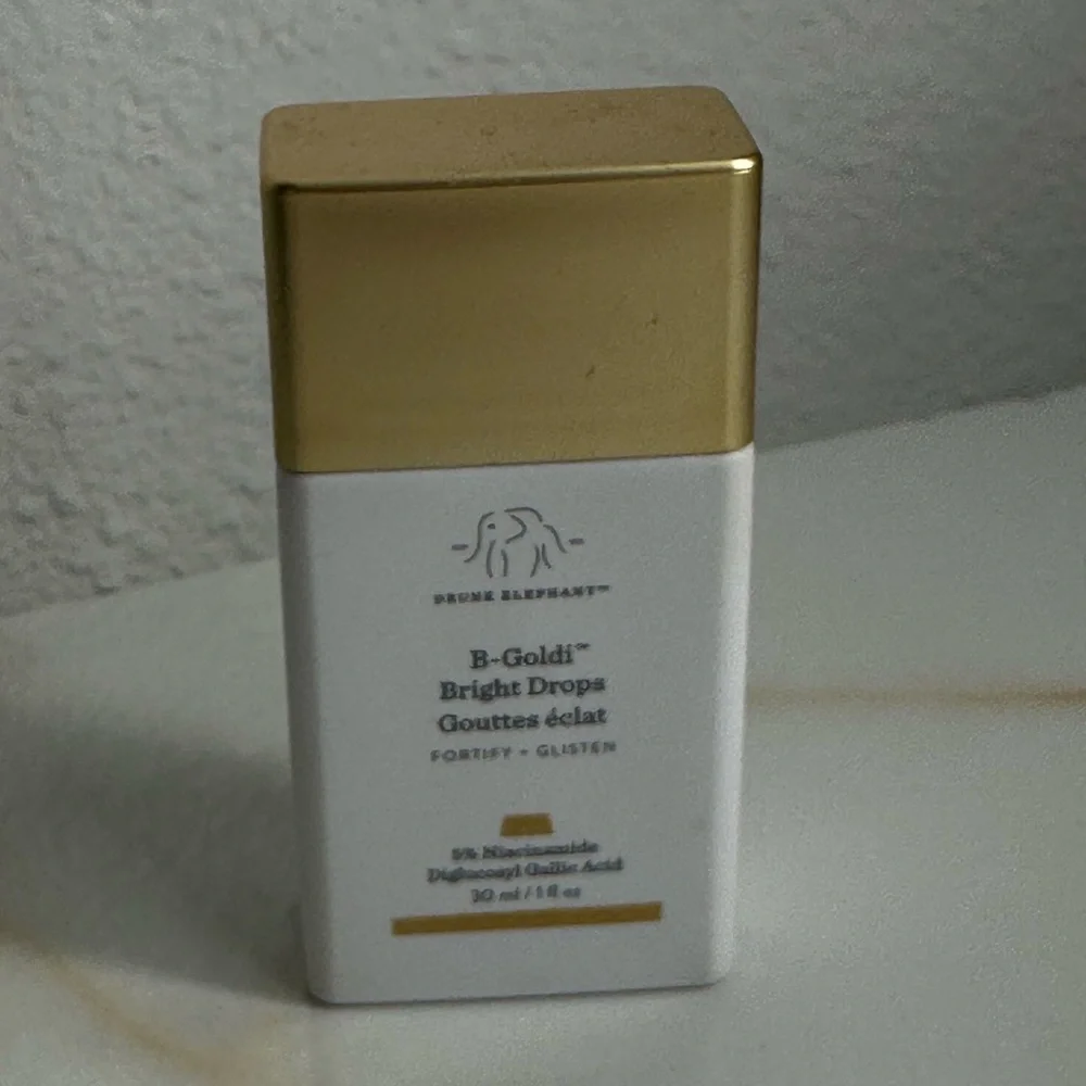 Drunk Elephant Gold and White Skincare Elixir